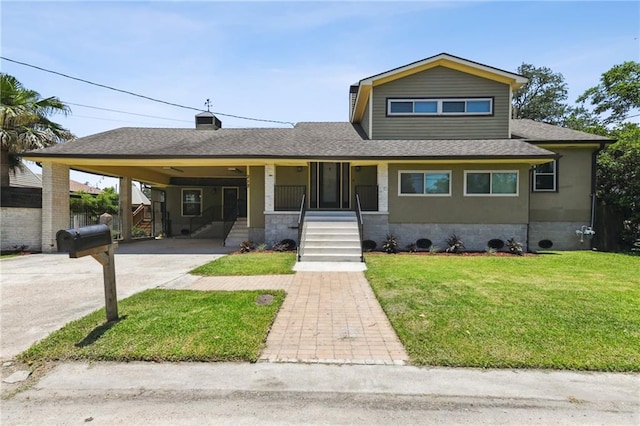 view of front facade with a front lawn, a porch, and a carport