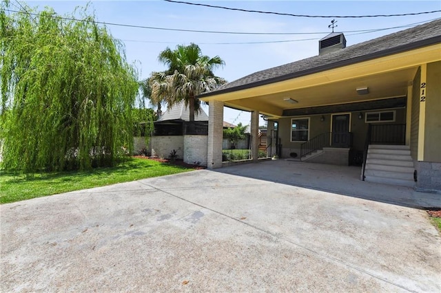 view of patio / terrace with a carport