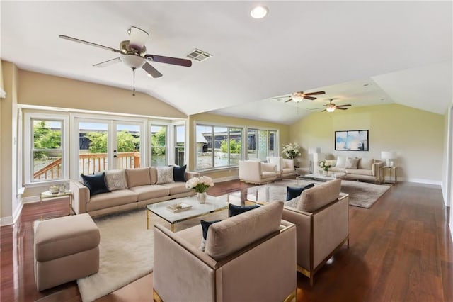 living room with ceiling fan, lofted ceiling, and dark wood-type flooring