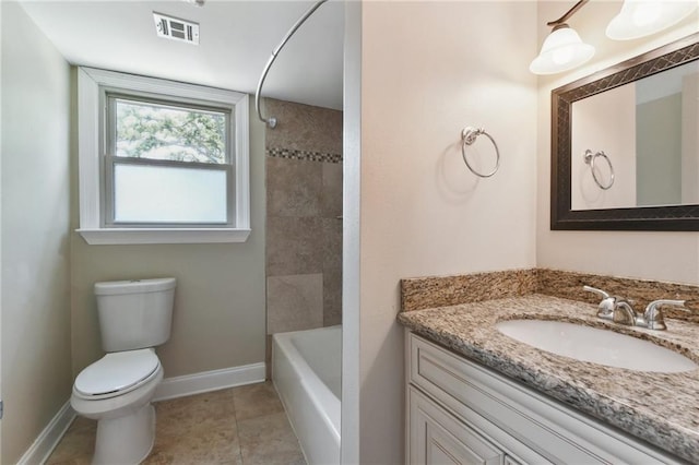 full bathroom featuring tile patterned floors, vanity, tiled shower / bath combo, and toilet