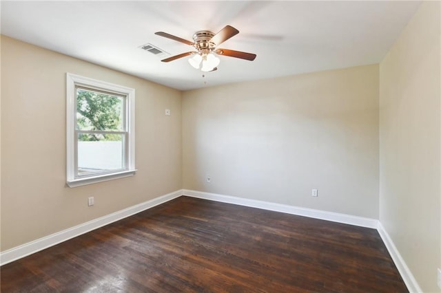 unfurnished room with ceiling fan and dark hardwood / wood-style flooring