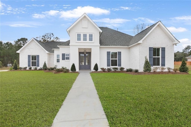 modern farmhouse featuring french doors and a front yard