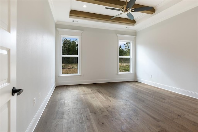 unfurnished room with hardwood / wood-style floors, a raised ceiling, ceiling fan, and crown molding