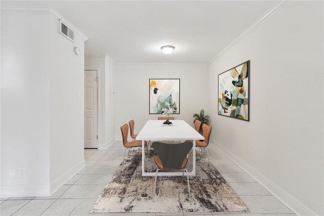 dining area featuring light tile patterned floors and ornamental molding