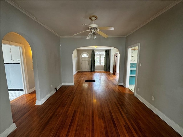 entryway featuring ceiling fan, crown molding, and dark hardwood / wood-style floors