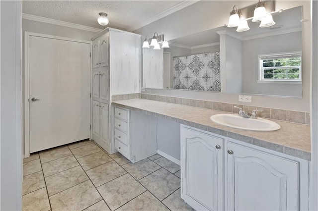 full bath featuring tile patterned flooring, crown molding, vanity, and a textured ceiling