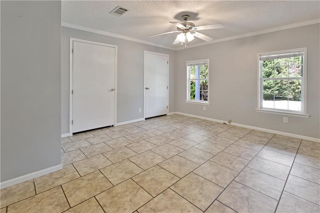 empty room featuring visible vents, a textured ceiling, crown molding, baseboards, and ceiling fan