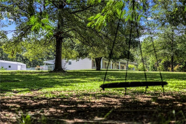 view of property's community featuring a yard