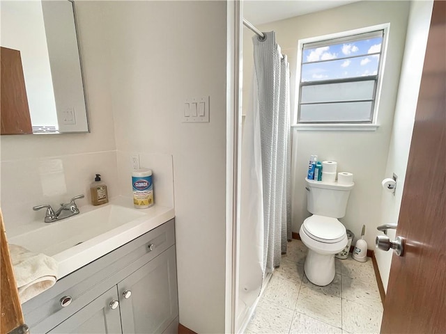 bathroom with vanity, toilet, and a shower with shower curtain