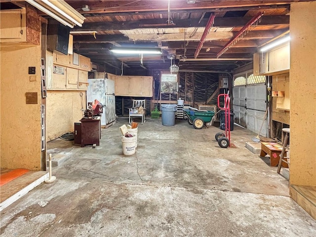 basement with white fridge