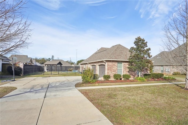 view of front of home featuring a garage and a front yard