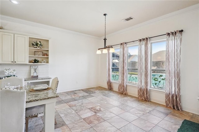 unfurnished dining area featuring a healthy amount of sunlight and ornamental molding