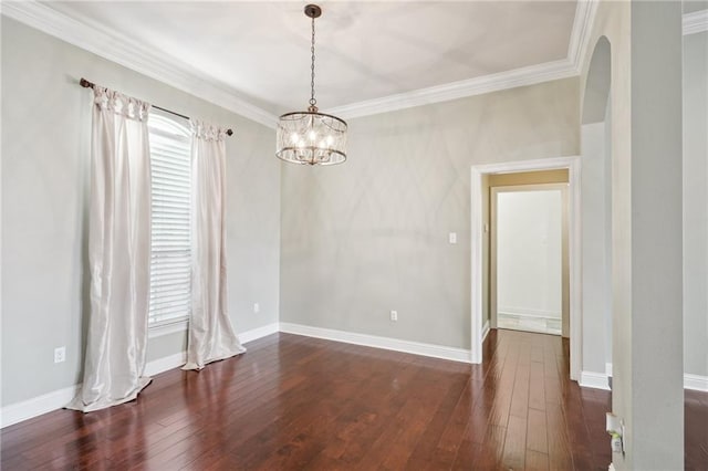 unfurnished room with crown molding, a healthy amount of sunlight, and dark hardwood / wood-style floors