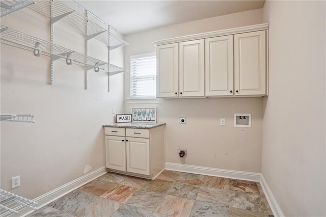 washroom with hookup for a washing machine, cabinets, and hookup for an electric dryer