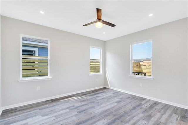 empty room featuring light hardwood / wood-style floors and ceiling fan