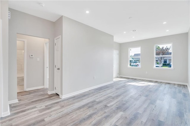 spare room featuring light hardwood / wood-style floors