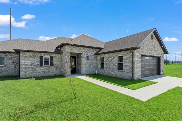 french country home with a garage and a front yard