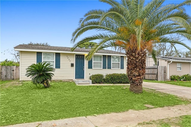 ranch-style house with a front lawn