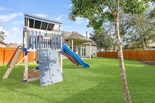 view of jungle gym featuring a yard