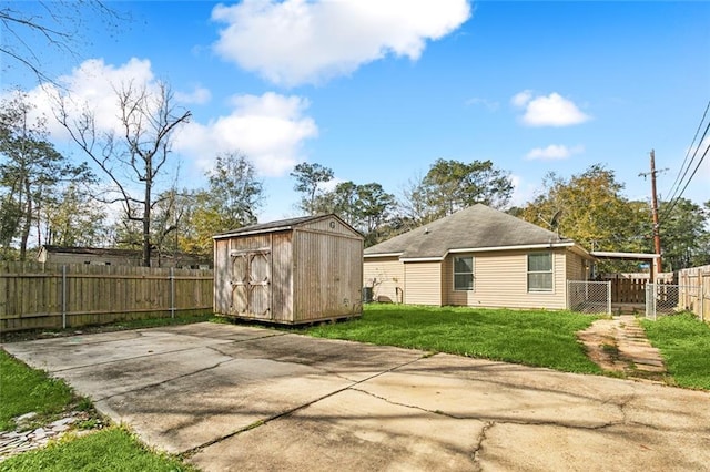 exterior space featuring a yard and a storage shed