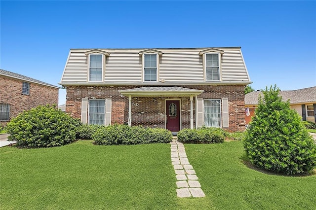 front facade with a front lawn