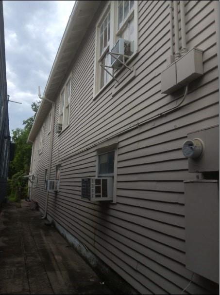 view of side of property with cooling unit