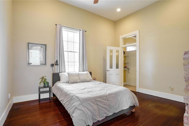 bedroom featuring dark hardwood / wood-style flooring and ceiling fan