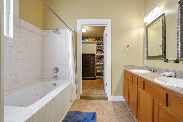 bathroom featuring tile patterned floors, shower / bath combo, and vanity