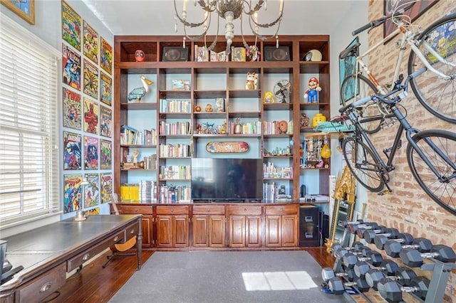 interior space with hardwood / wood-style floors and a chandelier