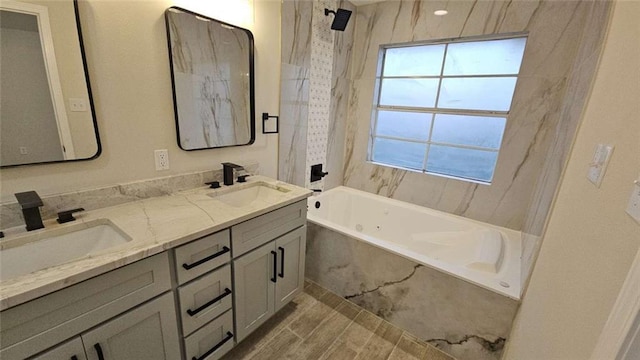 bathroom featuring tile patterned flooring, vanity, and tiled shower / bath combo