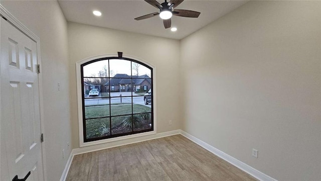 empty room featuring ceiling fan and light wood-type flooring