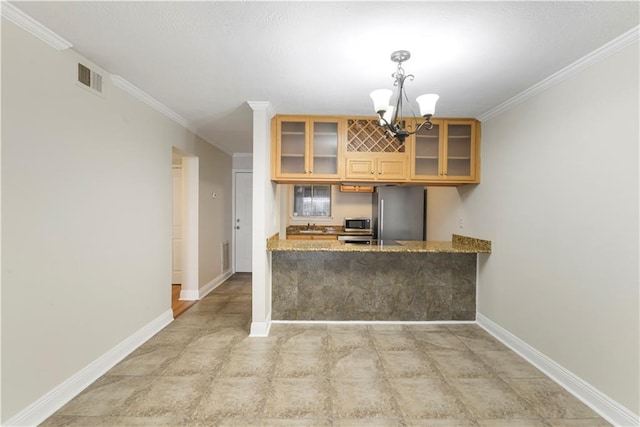 kitchen with light stone counters, crown molding, and appliances with stainless steel finishes