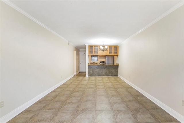 unfurnished living room with crown molding and a chandelier