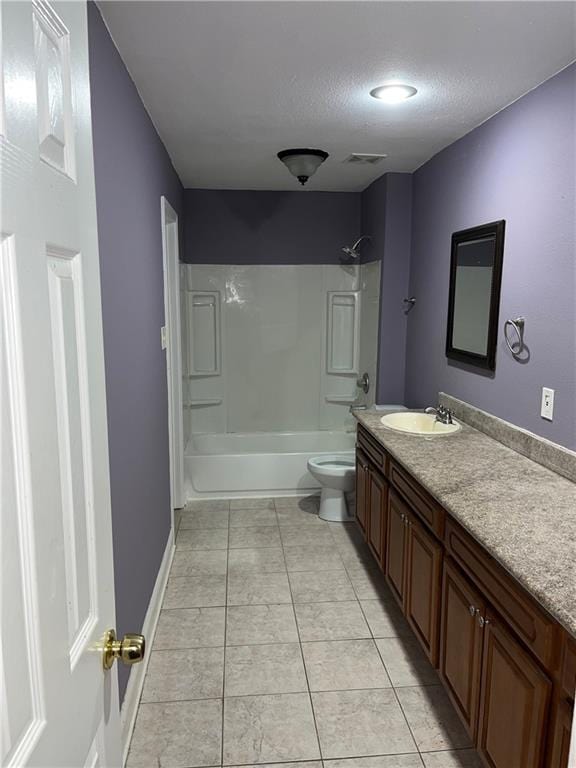 full bathroom featuring tile patterned flooring, shower / bath combination, a textured ceiling, toilet, and vanity