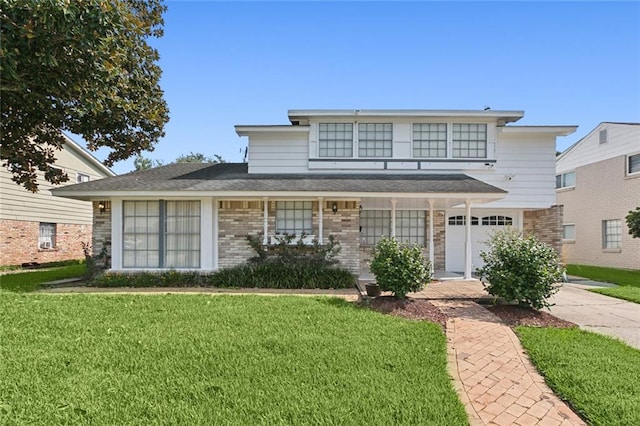 view of front facade with a garage and a front yard