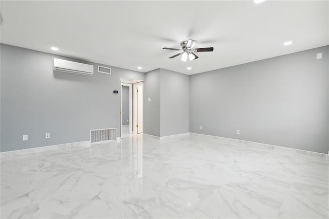 empty room featuring a wall mounted air conditioner and ceiling fan