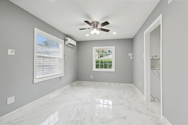 empty room featuring an AC wall unit and ceiling fan