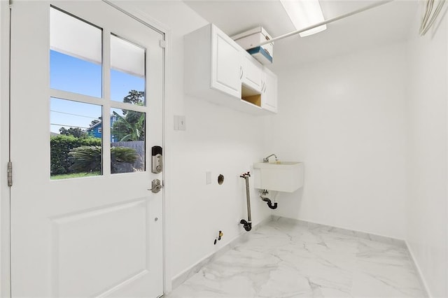 washroom featuring cabinets and gas dryer hookup