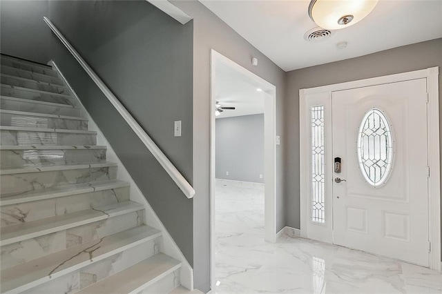 foyer featuring ceiling fan