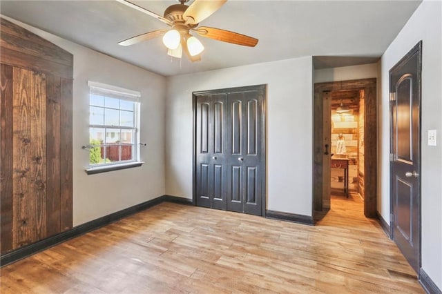 unfurnished bedroom with ceiling fan and light hardwood / wood-style floors