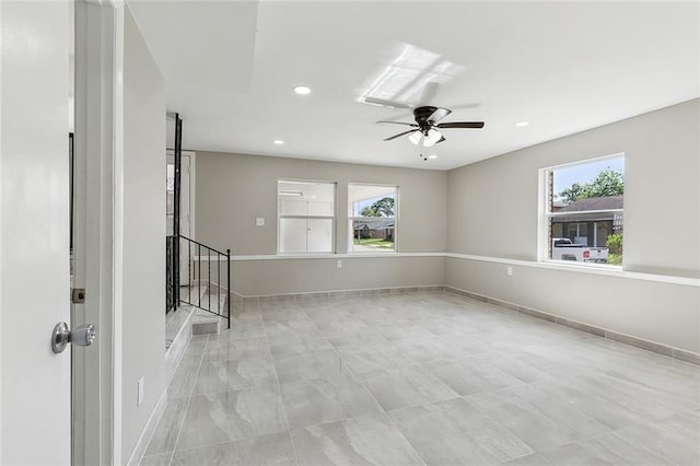 empty room with plenty of natural light and ceiling fan