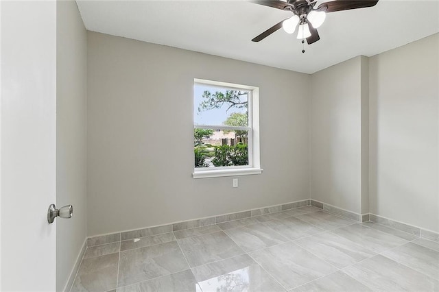 empty room featuring ceiling fan