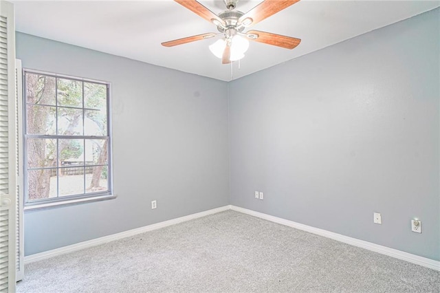 carpeted empty room with ceiling fan