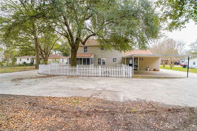 view of front facade with a carport