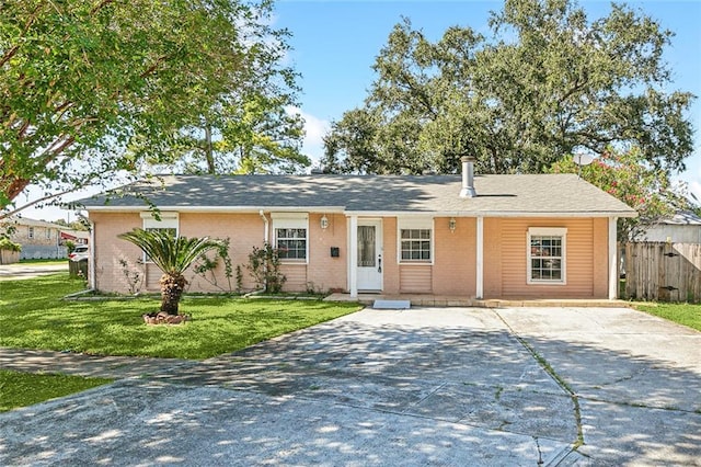 ranch-style home featuring a front yard