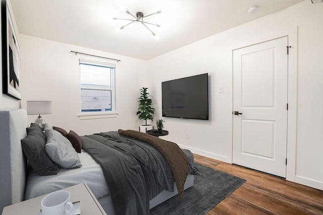 529 Central Ave, Jefferson, LA 70121 - bedroom featuring wood finished floors, baseboards, and a chandelier
