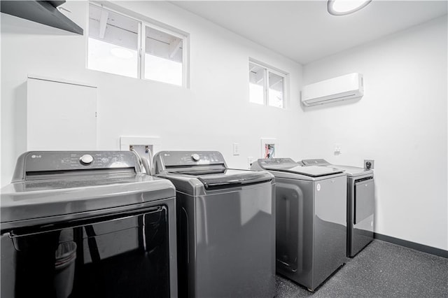 529 Central Ave, Jefferson, LA 70121 - laundry room featuring separate washer and dryer, an AC wall unit, and baseboards