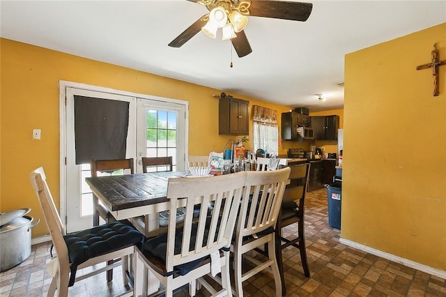 dining space featuring ceiling fan