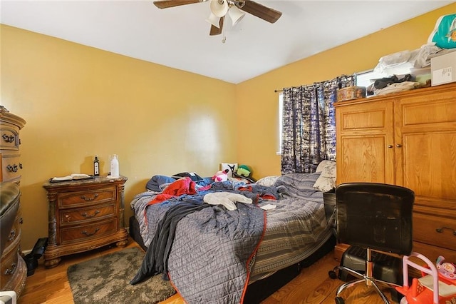 bedroom featuring ceiling fan and hardwood / wood-style flooring