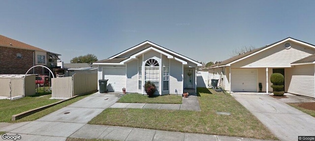 view of front facade featuring a garage and a front lawn